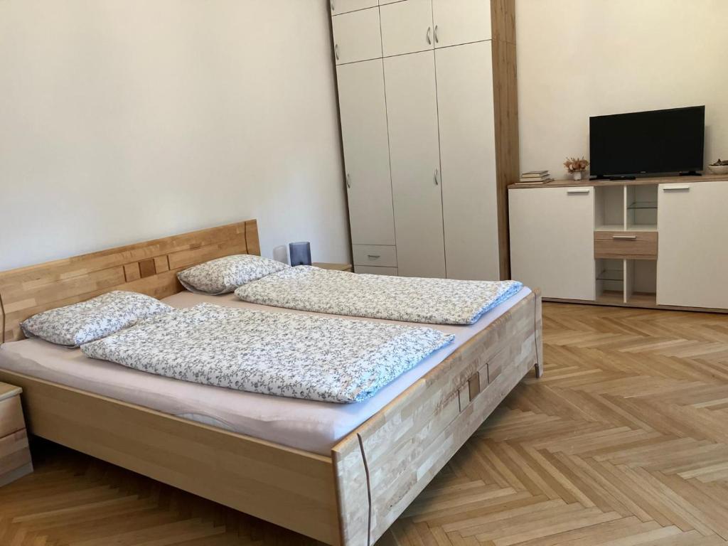 Postel nebo postele na pokoji v ubytování Schöne Wohnung im Helenental