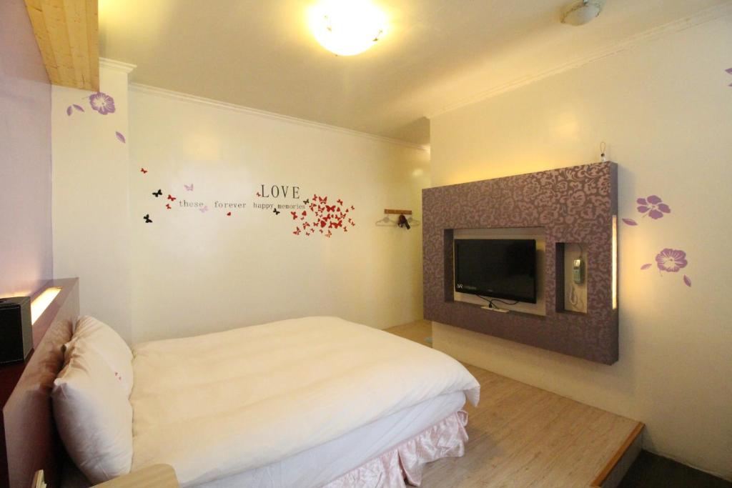 Postel nebo postele na pokoji v ubytování Cocos Hot Spring Hotel