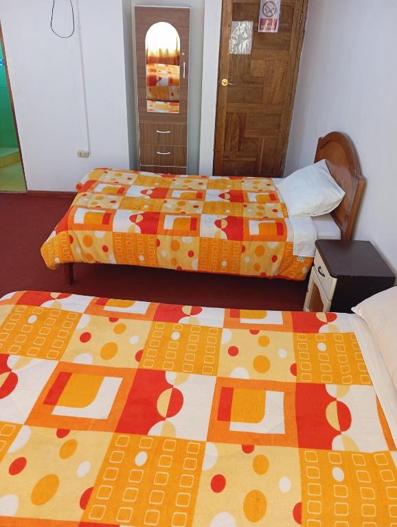 Postel nebo postele na pokoji v ubytování INKA'S DREAMS HOUSE