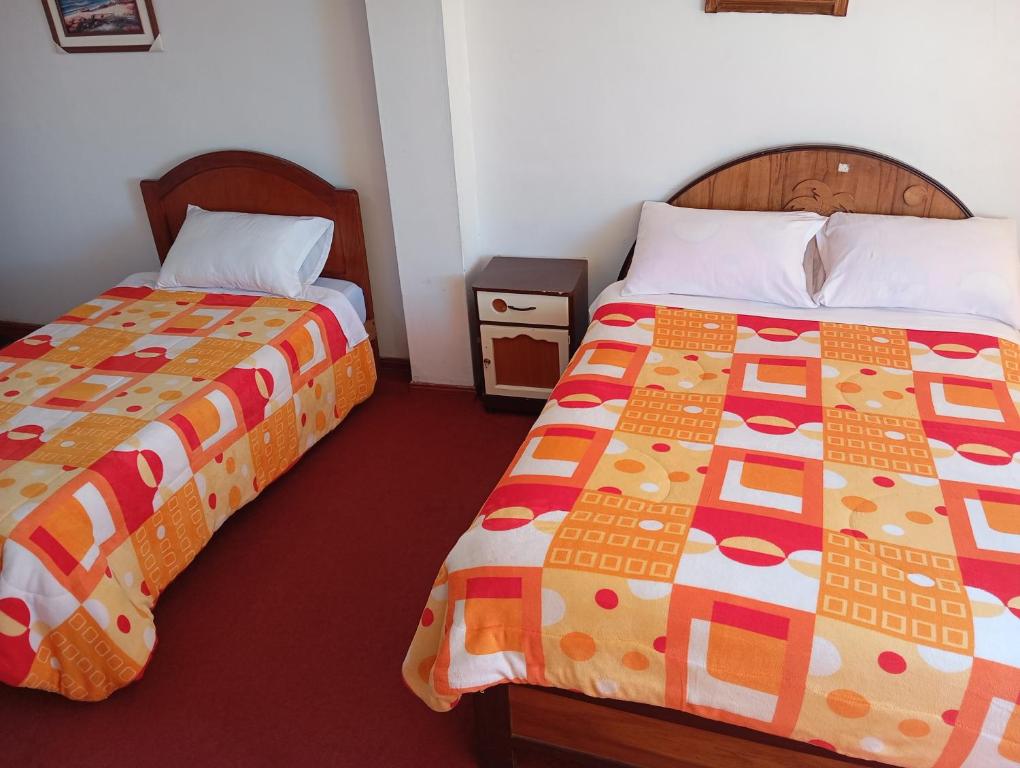 Postel nebo postele na pokoji v ubytování INKA'S DREAMS HOUSE