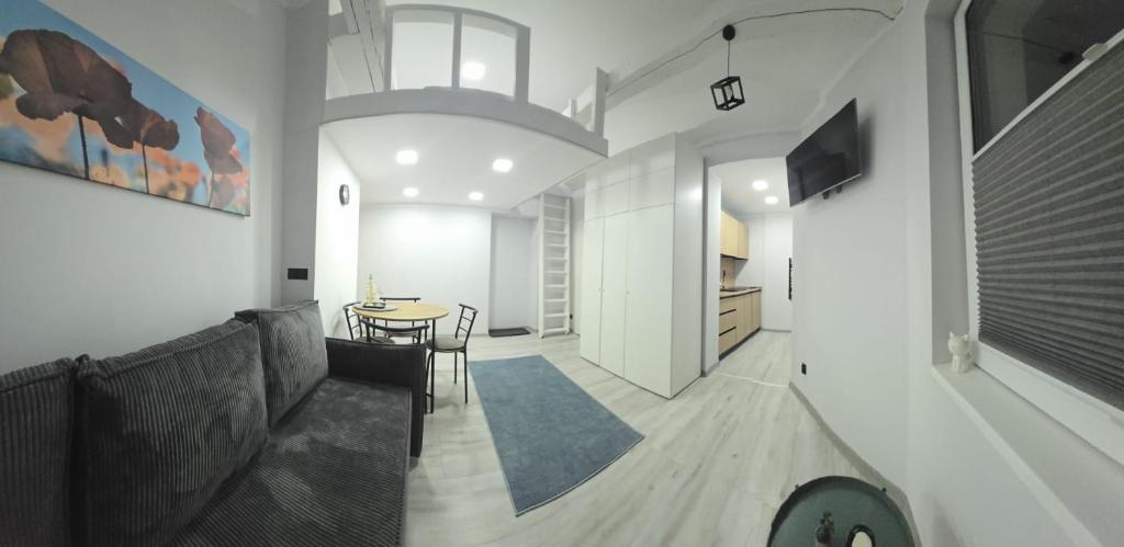 Una televisión o centro de entretenimiento en Apartament Patio Antresol 1 Świnoujście