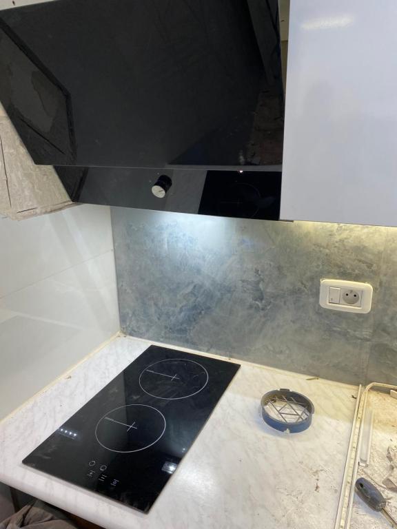 Cuisine ou kitchenette dans l'établissement Suite d'Hôtel vue sur mer