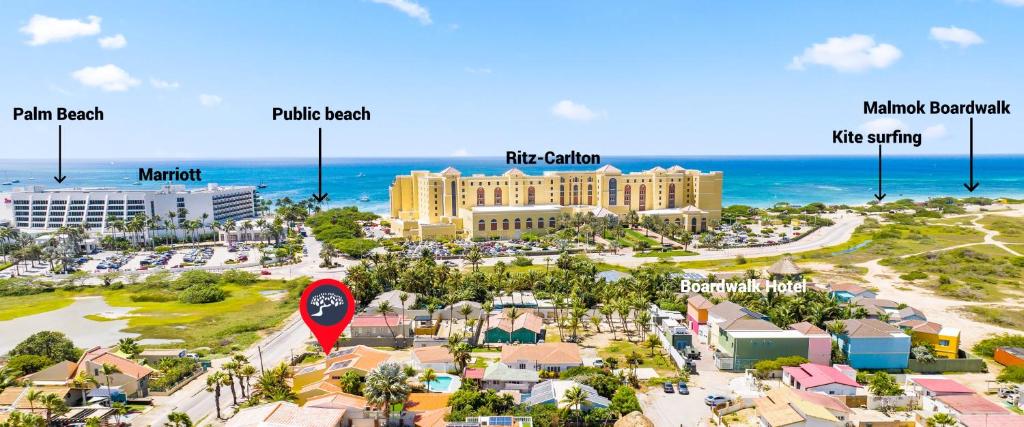 an aerial view of a resort with the ocean at Palm Beach Paradise by Bocobay in Palm-Eagle Beach