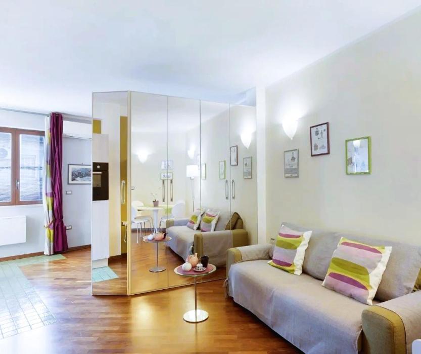 a living room with a couch and a table at Central Apartment in Salerno