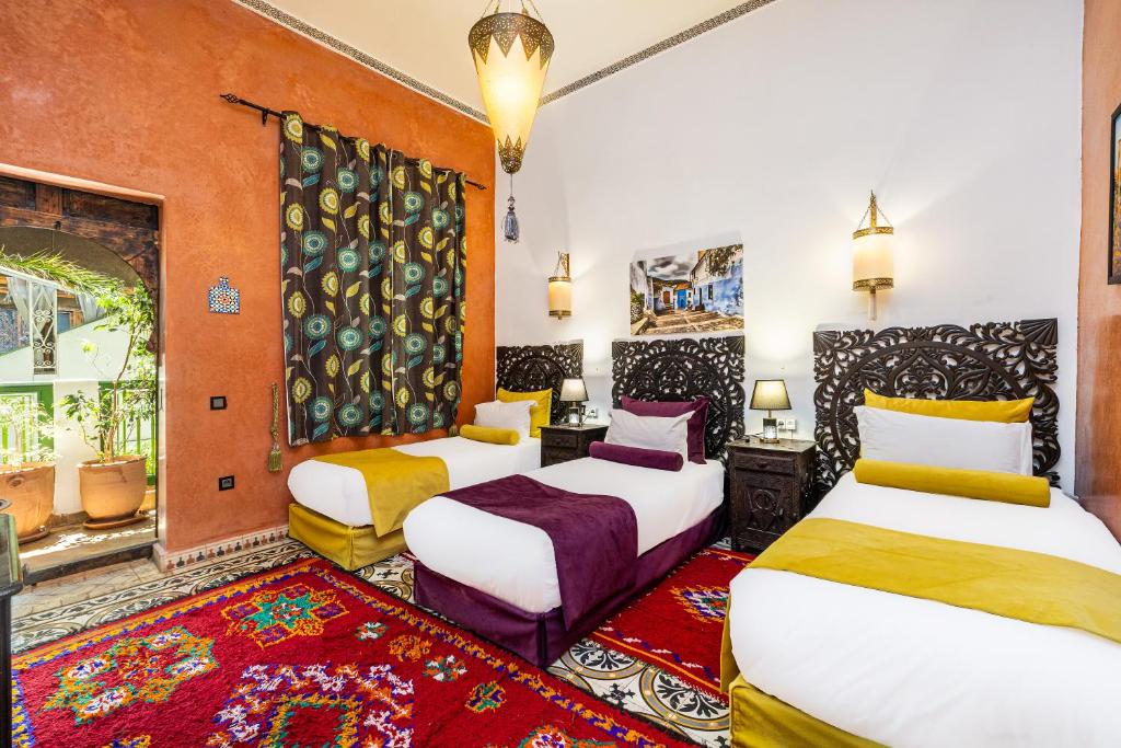 Postel nebo postele na pokoji v ubytování Riad Luzia