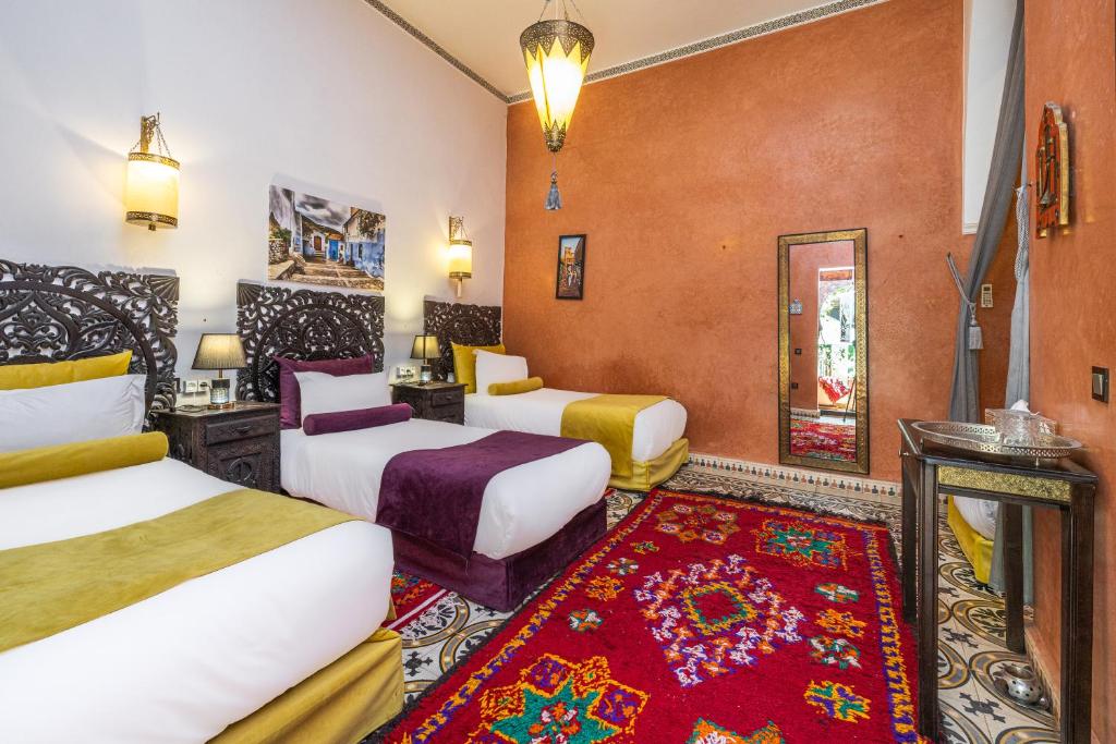Postel nebo postele na pokoji v ubytování Riad Luzia