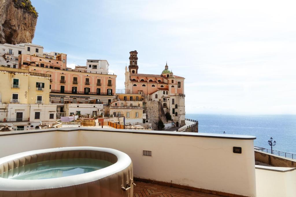 a view of a city from a building with a bath tub at Casa Lauritano in Atrani