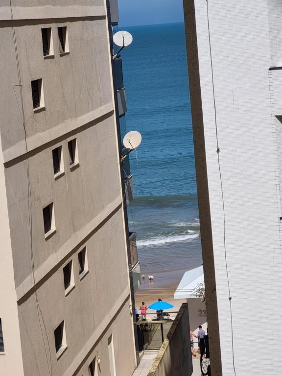 a view of the beach from the balcony of a building at Ed Ravena Com vista mar e elevador in Guarapari