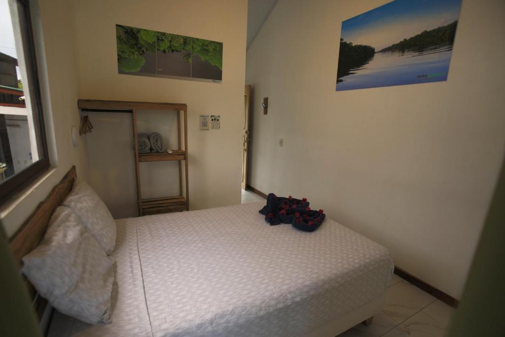Postel nebo postele na pokoji v ubytování Hotel Pura Natura Riverside Tortuguero