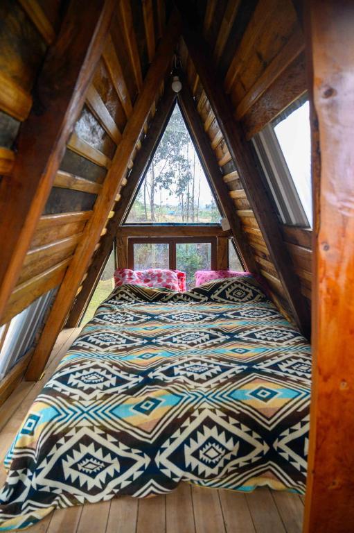 Postel nebo postele na pokoji v ubytování El Tio Hostal