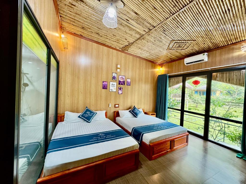 Postel nebo postele na pokoji v ubytování Green Valley Homestay - Thung Lũng Xanh