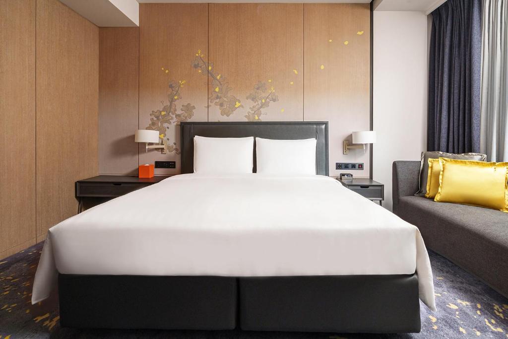 Postel nebo postele na pokoji v ubytování Hotel Nikko Kaohsiung