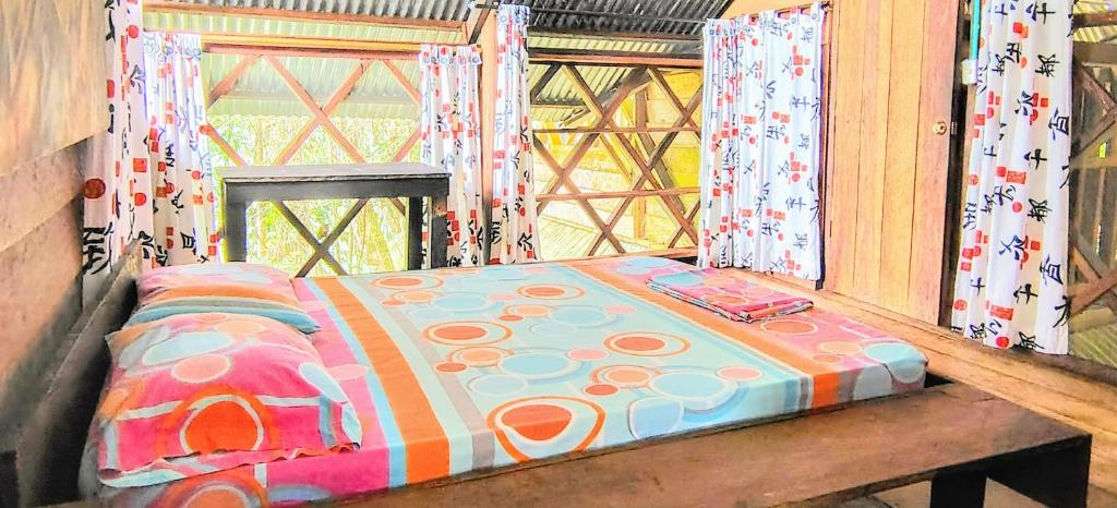 Postel nebo postele na pokoji v ubytování Paraíso Ayahuasca Hotel & Tours