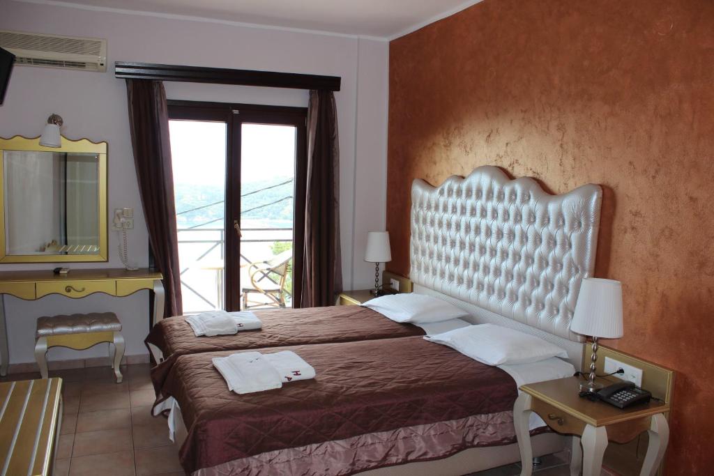 Postel nebo postele na pokoji v ubytování Palatino Hotel