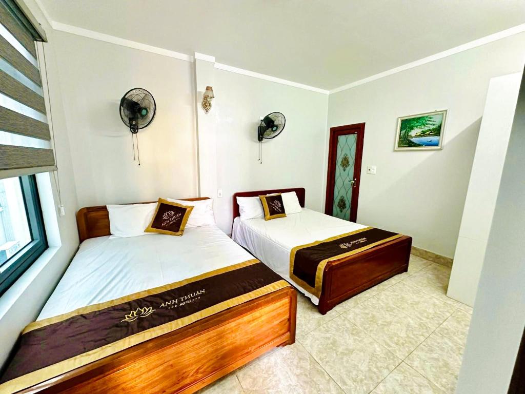 En eller flere senge i et værelse på Anh Thuận Cát Bà Hotel