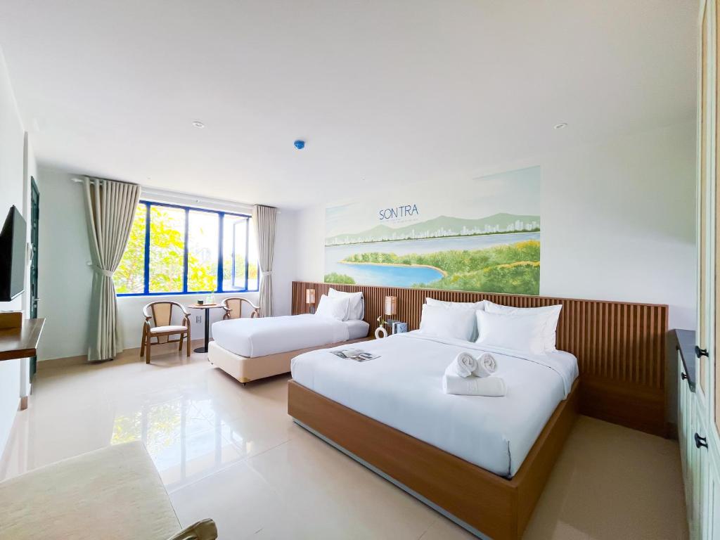 Giường trong phòng chung tại Sujet Residence Da Nang by Haviland