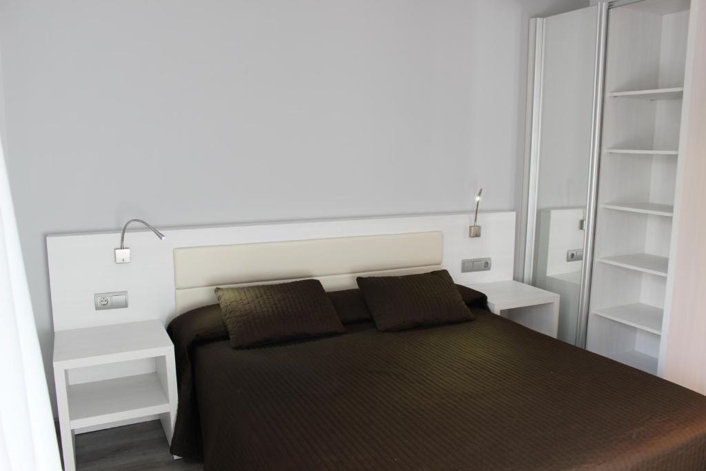 Postel nebo postele na pokoji v ubytování Hotel Salomé