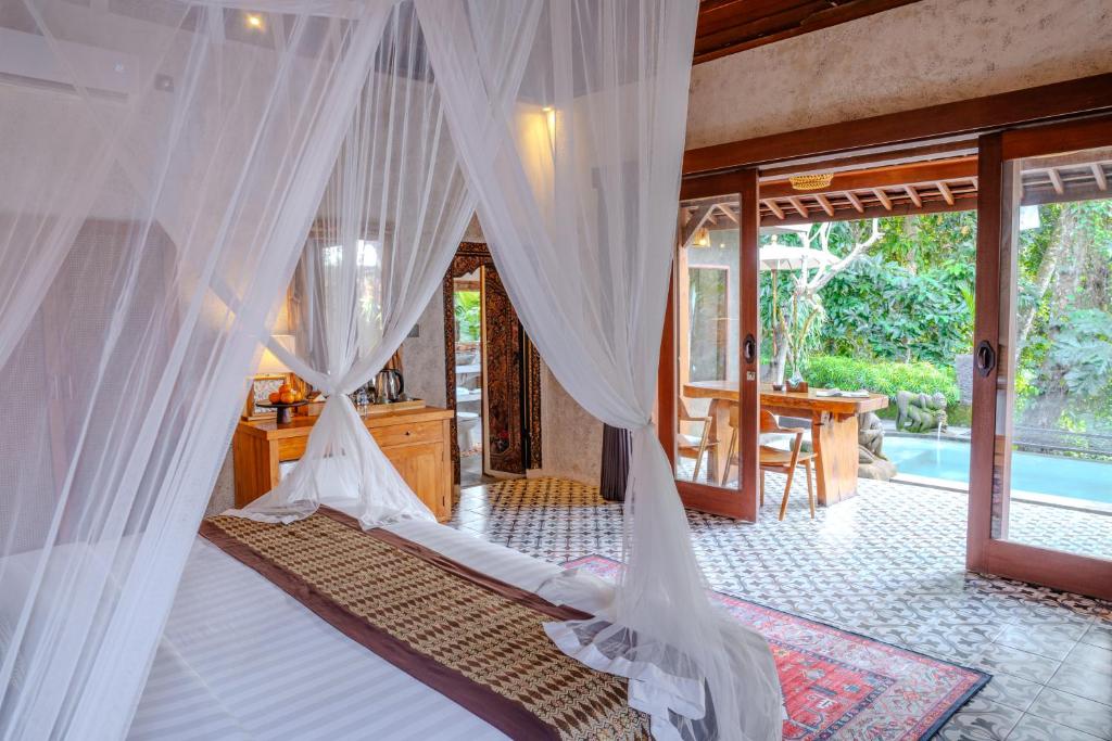 Postel nebo postele na pokoji v ubytování Hoshi Jungle Resort