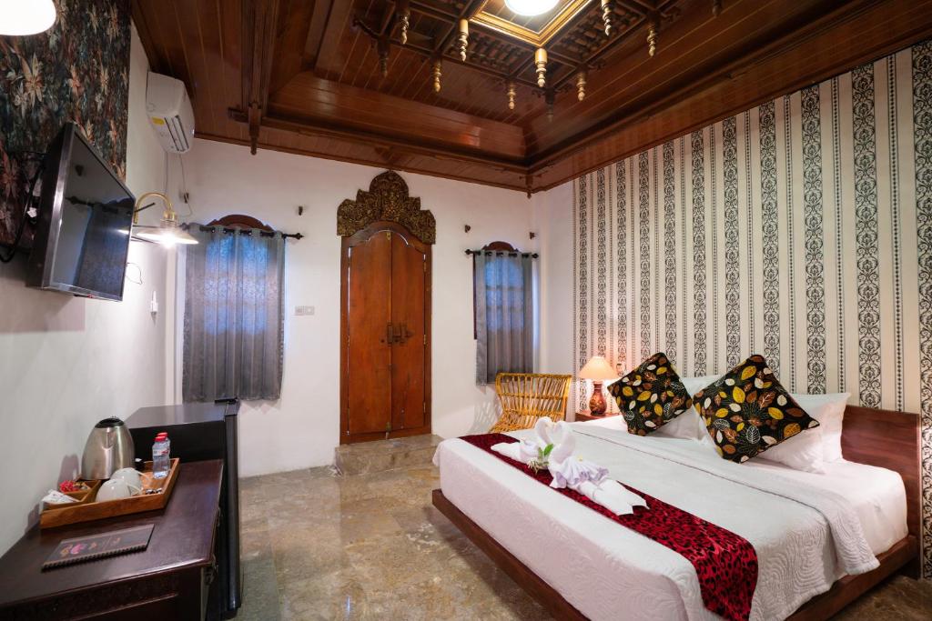 Postel nebo postele na pokoji v ubytování The Saharah Mirage Bali