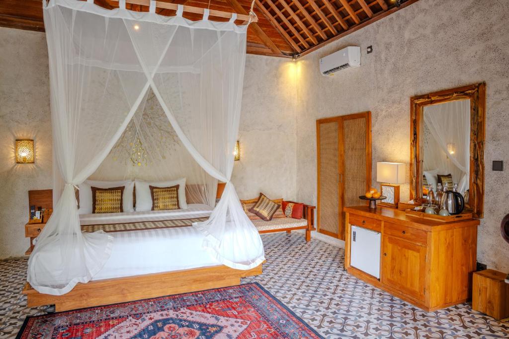 Postel nebo postele na pokoji v ubytování Hoshi Jungle Resort