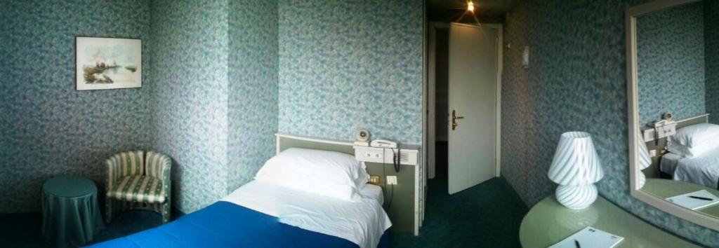 Postel nebo postele na pokoji v ubytování Hotel Il Burchiello