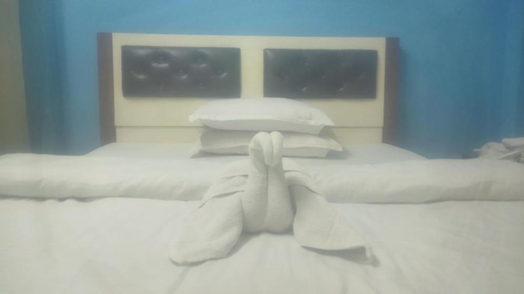 Ένα ή περισσότερα κρεβάτια σε δωμάτιο στο Hotel happy valley pvt ltd