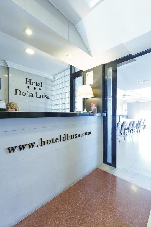 a lobby of a hoteloda lusita with a waiting room at Hotel Doña Luisa in San Luis de Sabinillas