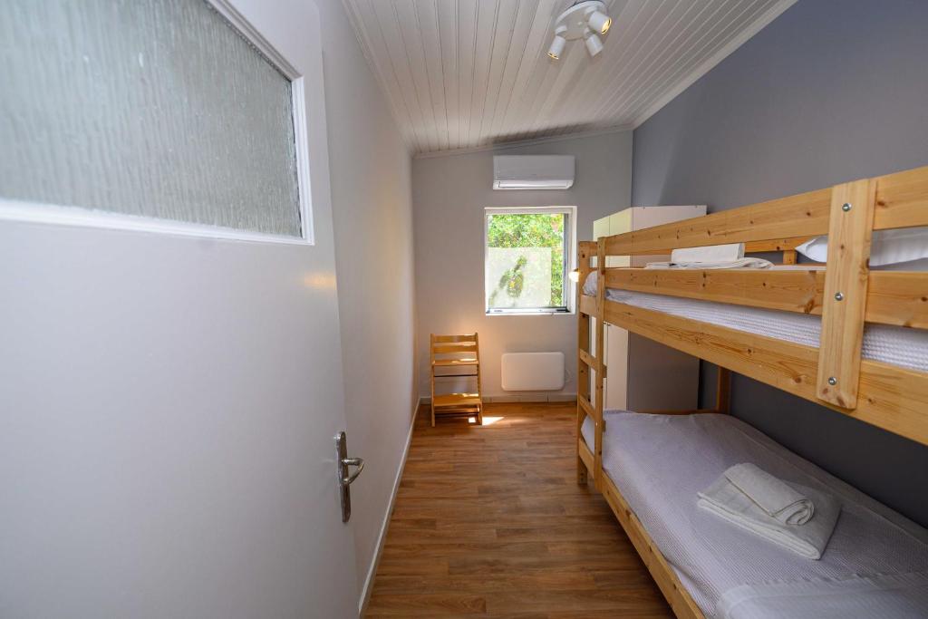 Postel nebo postele na pokoji v ubytování Salty Noses Beach House Paradise Perfect for Families