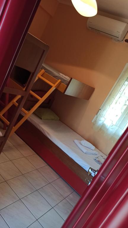 A bed or beds in a room at The Emerald Lopi, 2km from Ammolofoi beach! The best kept secret in nature, of Nea Peramos