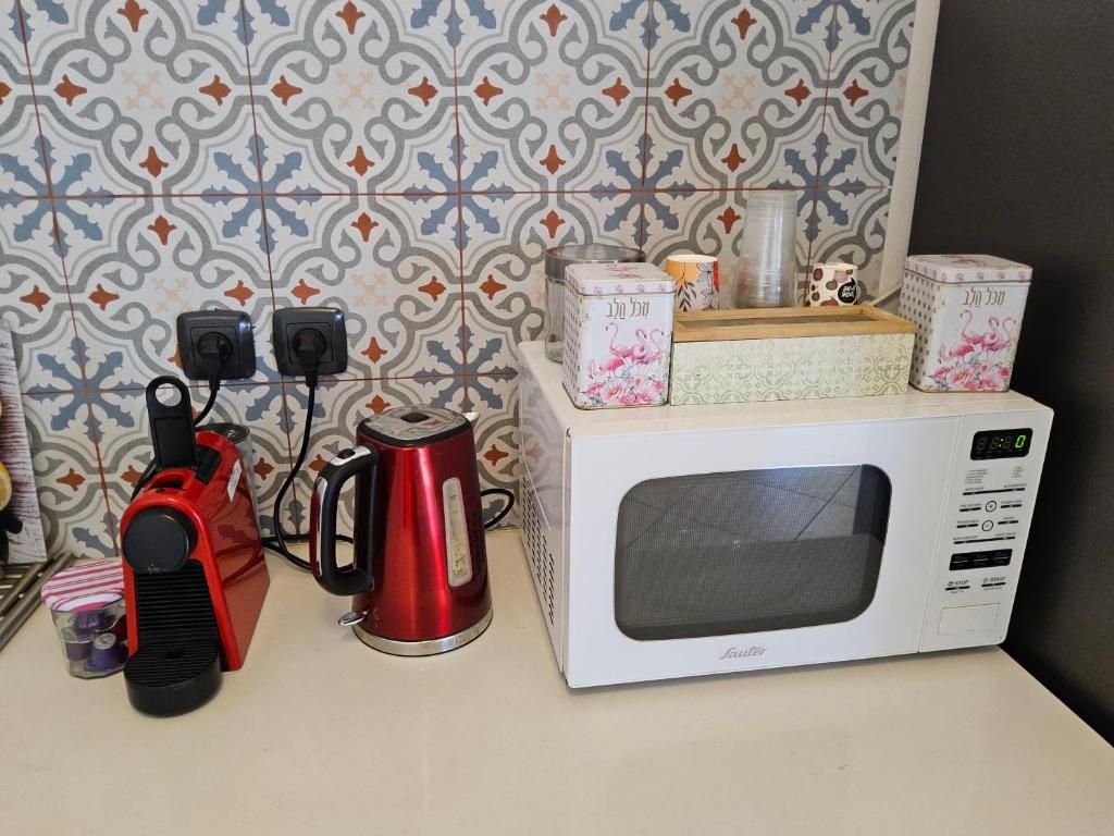 Kuchyň nebo kuchyňský kout v ubytování shohamseaview