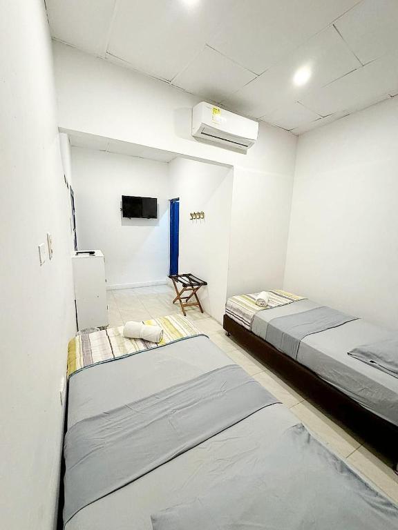Postel nebo postele na pokoji v ubytování Hostal 1811