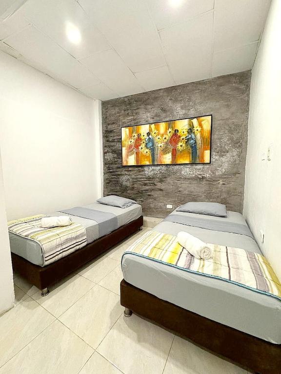 Postel nebo postele na pokoji v ubytování Hostal 1811