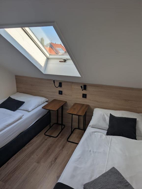 Postel nebo postele na pokoji v ubytování Penzion Ema B&B