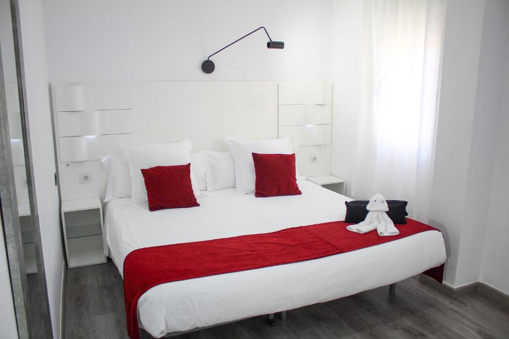 Postel nebo postele na pokoji v ubytování Hotel Pepo