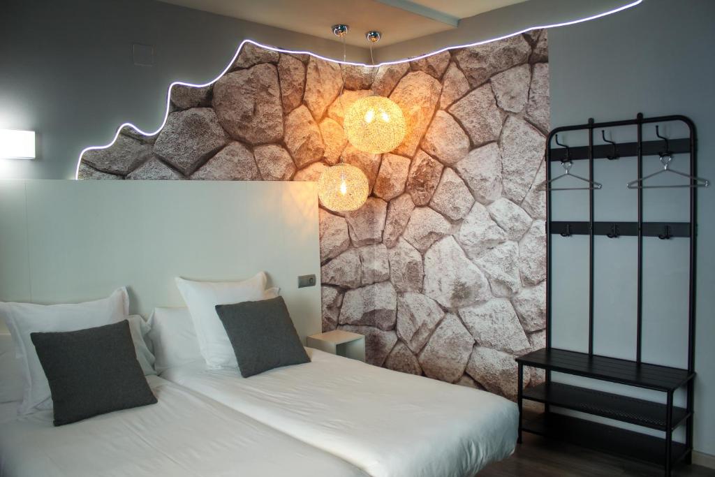 Postel nebo postele na pokoji v ubytování Hotel Pepo