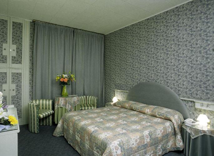 Postel nebo postele na pokoji v ubytování Hotel Il Burchiello