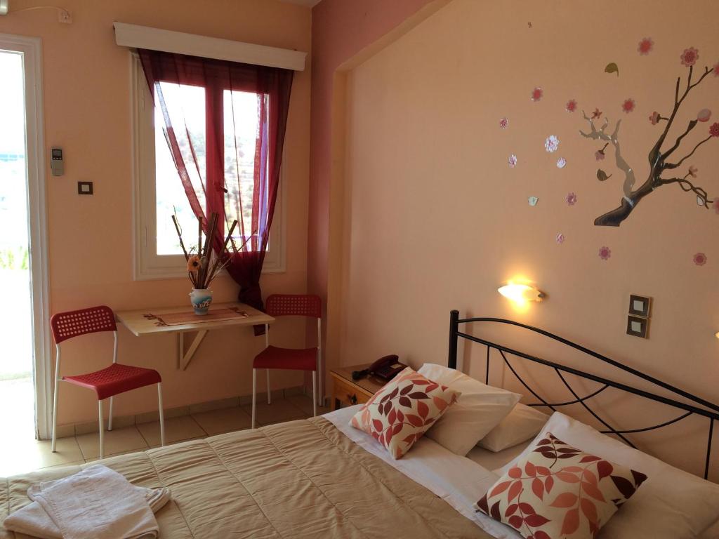 Postel nebo postele na pokoji v ubytování Isidora Hotel