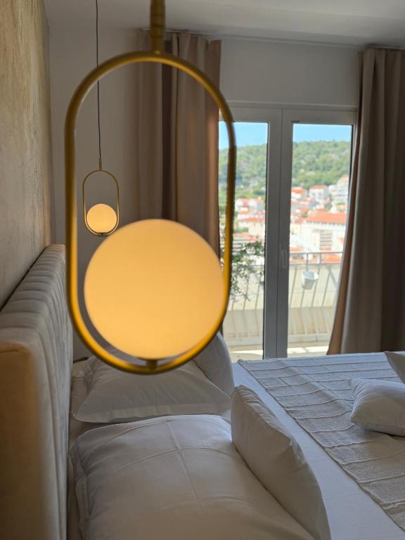 Postel nebo postele na pokoji v ubytování Oleander Apartment & Room Centar