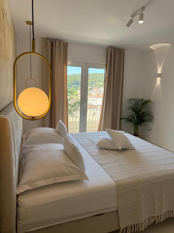 Postel nebo postele na pokoji v ubytování Oleander Apartment & Room Centar