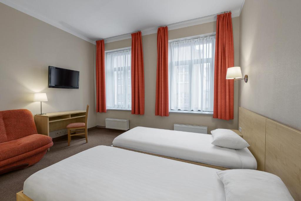 Postel nebo postele na pokoji v ubytování Rija Domus Hotel