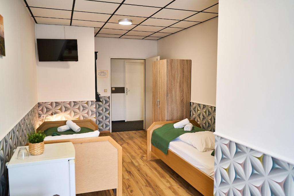Postel nebo postele na pokoji v ubytování Hotel Maximo