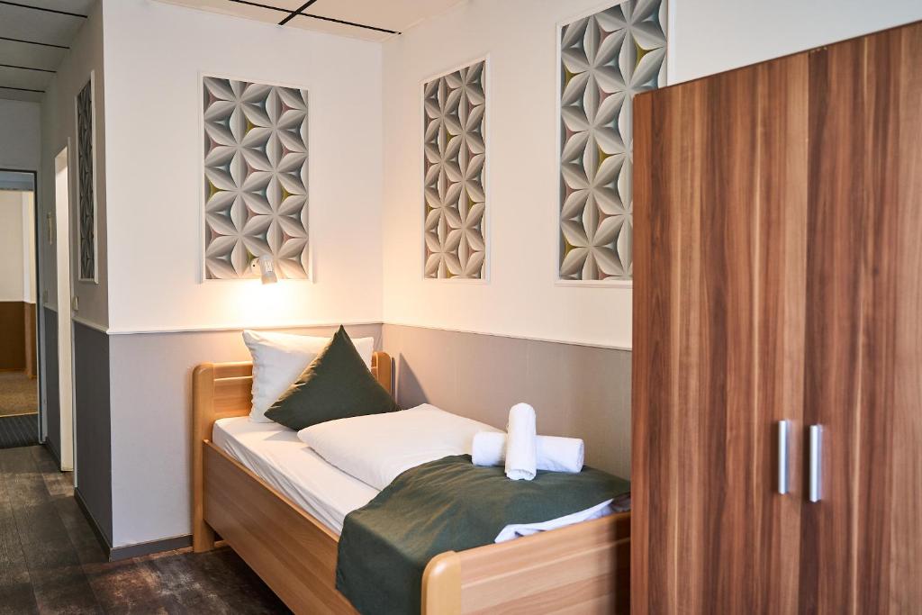 Postel nebo postele na pokoji v ubytování Hotel Maximo