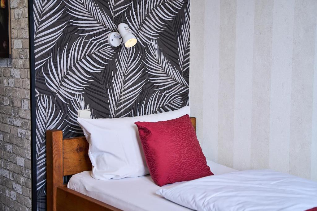 Postel nebo postele na pokoji v ubytování Hotel Maximo