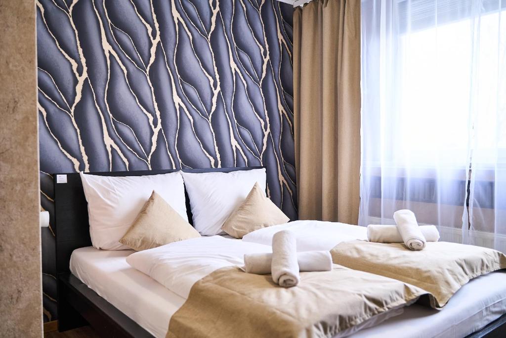 Postel nebo postele na pokoji v ubytování Hotel Maximo