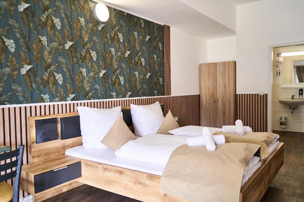 Postel nebo postele na pokoji v ubytování Hotel Maximo