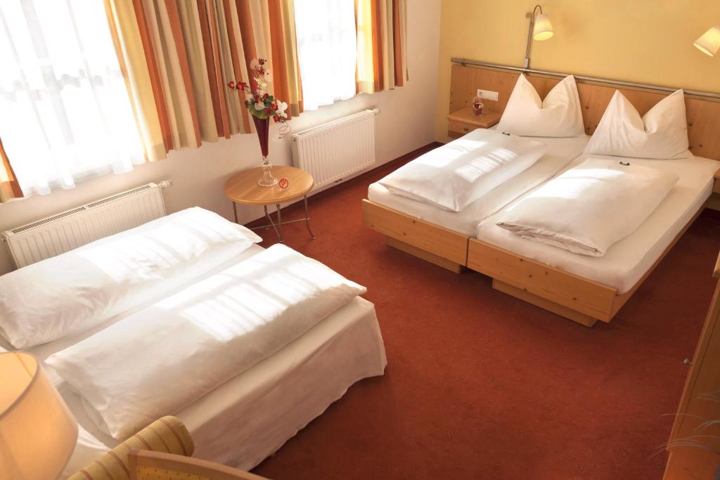 Postel nebo postele na pokoji v ubytování Hotel Kohlpeter