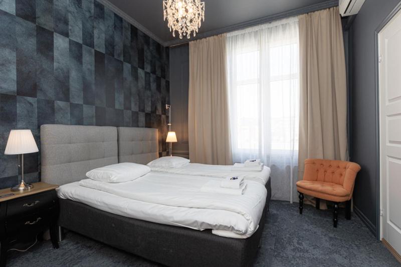 Postel nebo postele na pokoji v ubytování Hotell Drottninggatan 11