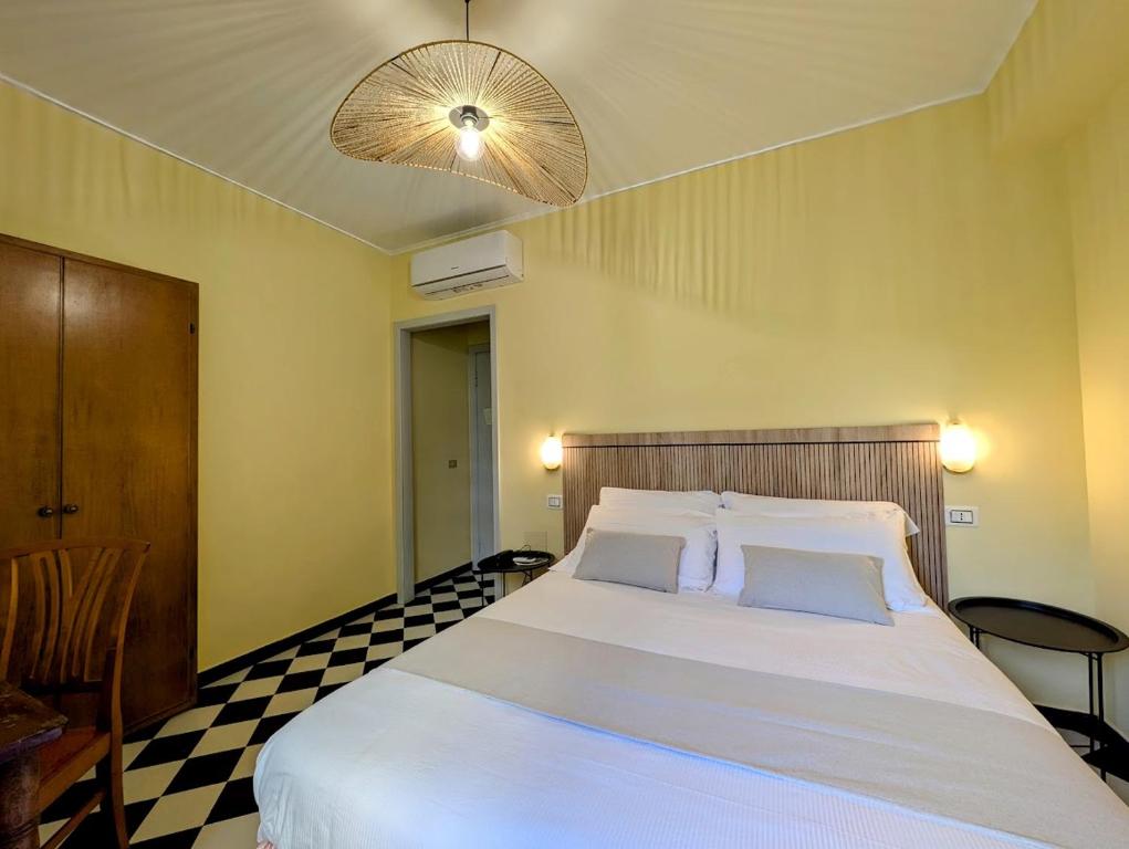 Postel nebo postele na pokoji v ubytování Villa Fieschi Boutique Hotel