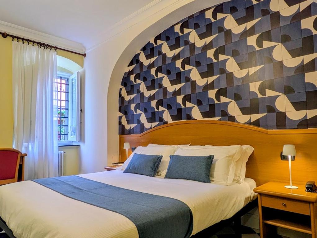 Postel nebo postele na pokoji v ubytování Villa Fieschi Boutique Hotel