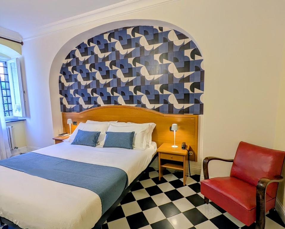 Postel nebo postele na pokoji v ubytování Villa Fieschi Boutique Hotel